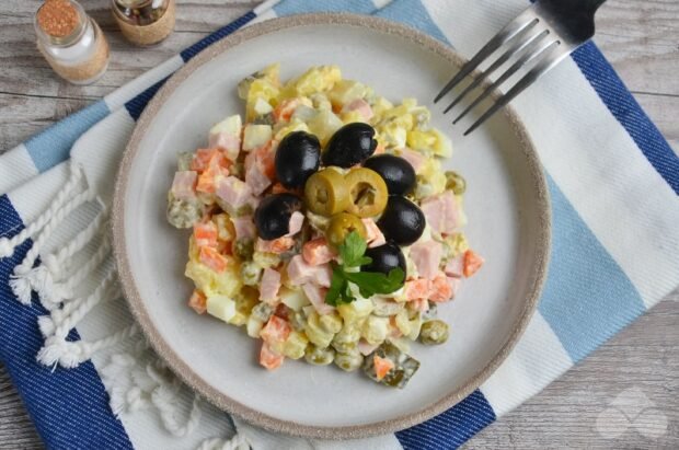 Olivier with boiled sausage, olives and olives