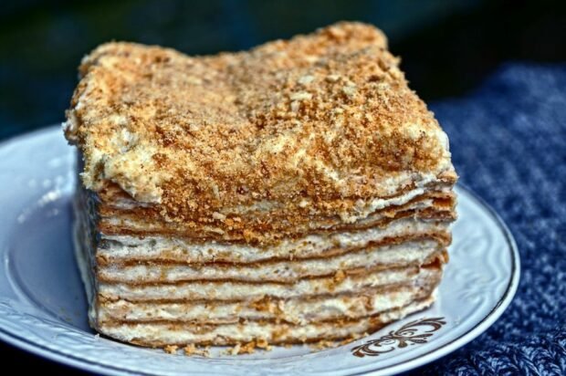 Sour cream cake in a frying pan at home 