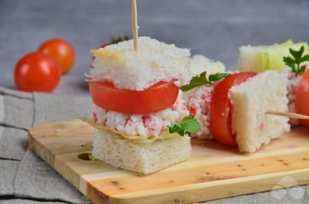 Canapes with crab sticks and tomatoes