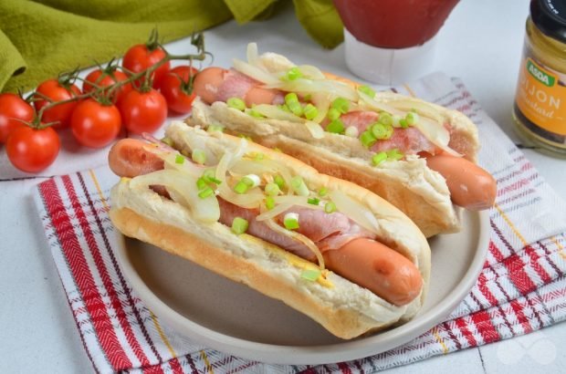 Homemade hot dog with bacon and green onions