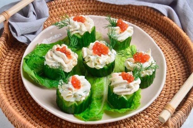 Canapes with cucumbers and red caviar