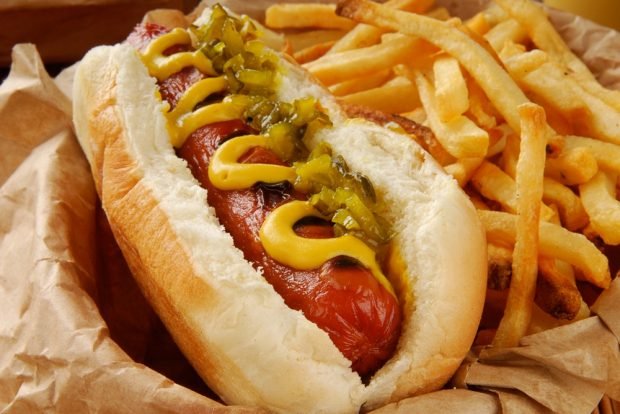 Hot dog with fried sausage and pickles