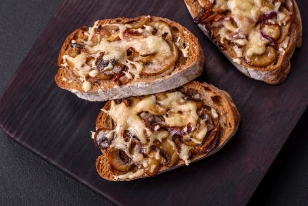 Hot sandwiches with mushrooms and cheese in the oven