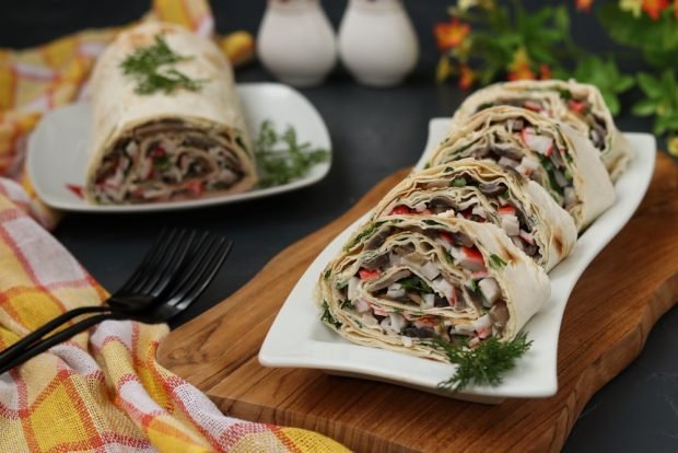 Pita bread roll with crab sticks and cucumber 