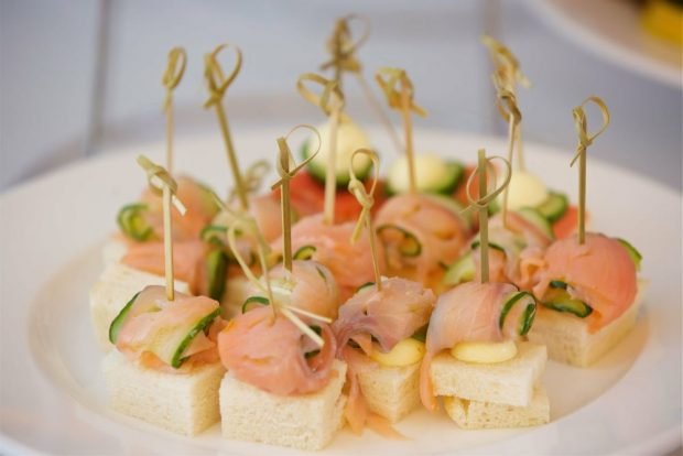 Canapes with red fish on skewers