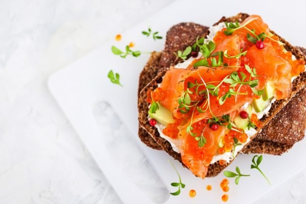 Sandwiches with red fish and cucumber for the festive table