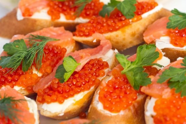 Sandwiches with red fish and caviar for the festive table