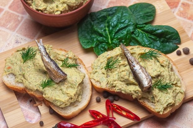 A spread of sprats and melted cheese 