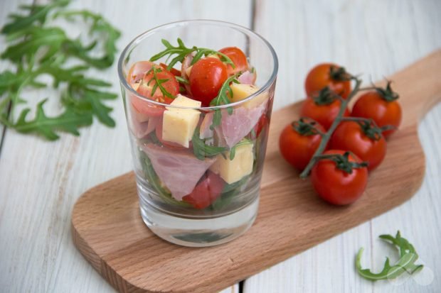 Cocktail salad with ham and cherry