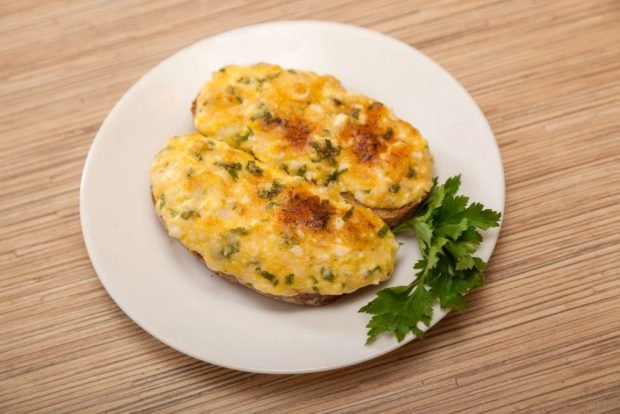 Sandwiches with egg, sausage and cheese in a frying pan