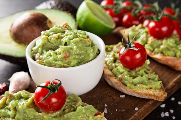 Guacamole with avocado and tomatoes 