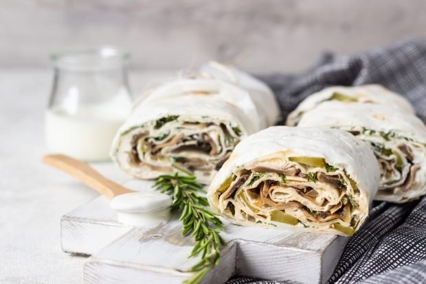 Pita bread roll with pickled cucumbers and mushrooms is a simple and delicious recipe for cooking step by step