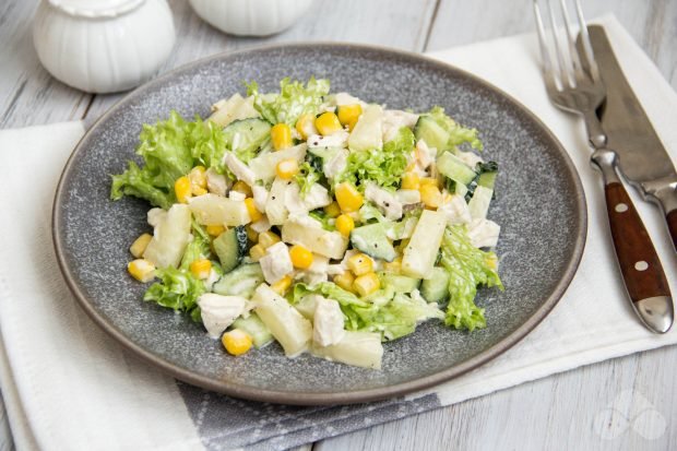 Meat salad with pineapples, corn and cucumbers