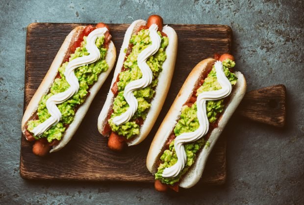 Hot dog with tomatoes and guacamole 