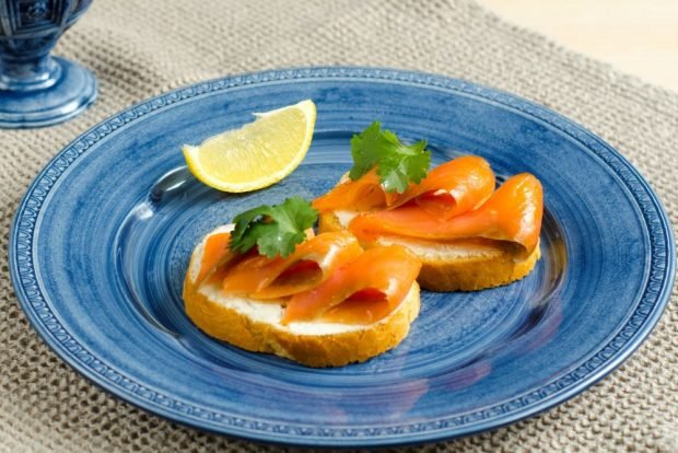 Sandwiches with red fish and cottage cheese for the festive table