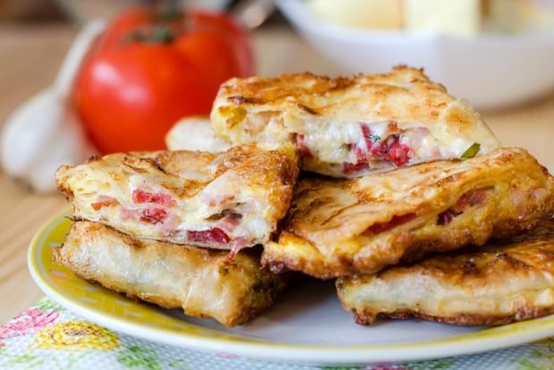 Simple hot sandwiches in pita bread in a frying pan