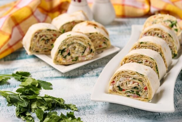 Lavash roll with crab sticks and herbs 