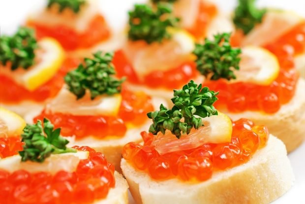 Canapes with red caviar