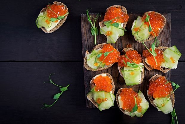 Sandwiches with red caviar for the festive table