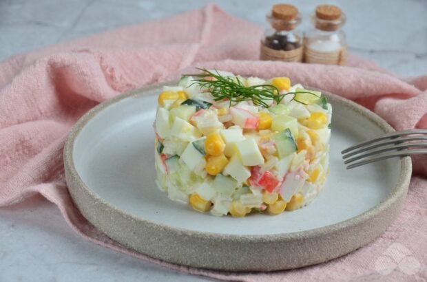 Salad with rice, eggs and crab sticks