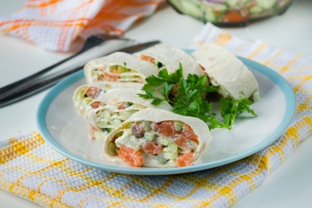 Pita bread roll with red fish, cottage cheese and cucumber 