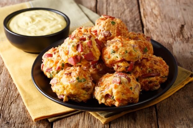 Fried balls with cheese and sausages