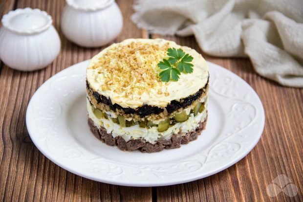 Festive puff salad with beef and prunes