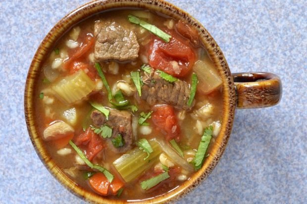 Soup with pork, celery, tomatoes and pearl barley