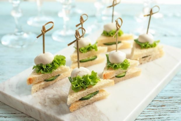 Simple canapes on skewers for a festive table