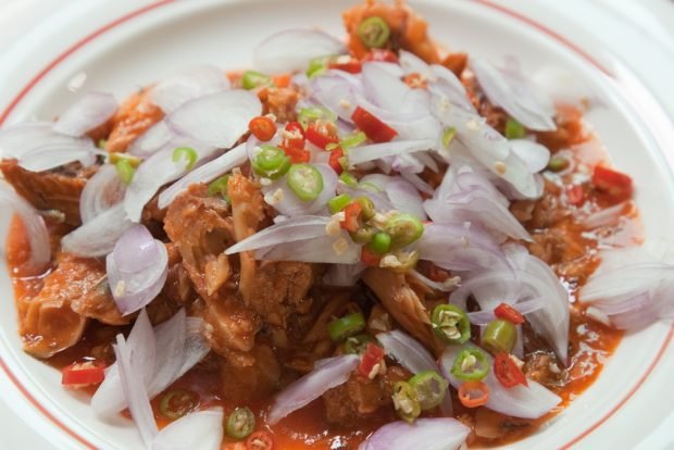 Salad with onion and fish in tomato