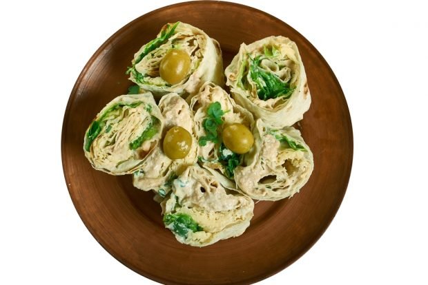 Pita bread roll with pate and herbs 