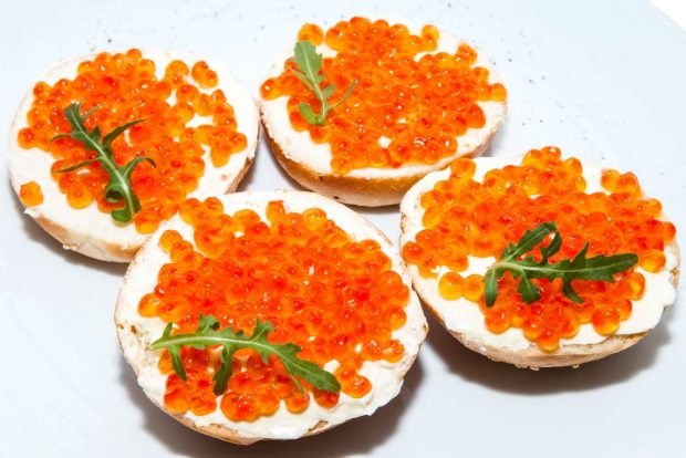 Sandwiches with red caviar and cottage cheese for the festive table