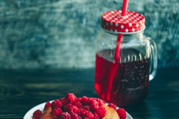 Sweet raspberry compote in a slow cooker