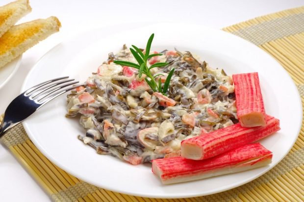 Salad with crab sticks, seaweed and eggs