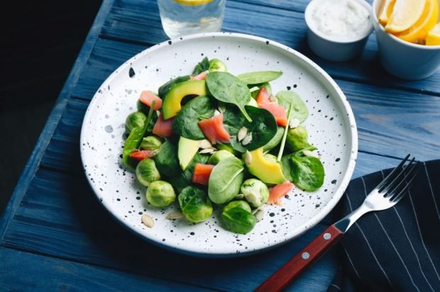 Salad with red fish, avocado and Brussels sprouts 