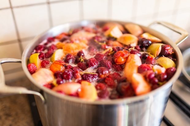 Compote with apples, apricots and berries 