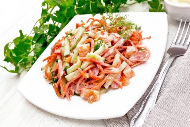 Salad with smoked sausage and Korean carrots is a simple and delicious recipe, how to cook step by step