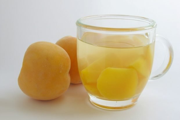 Compote of peeled peaches