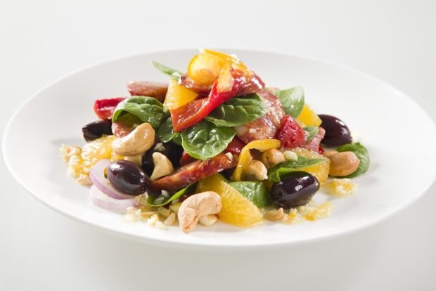 Festive salad with smoked sausage and oranges 