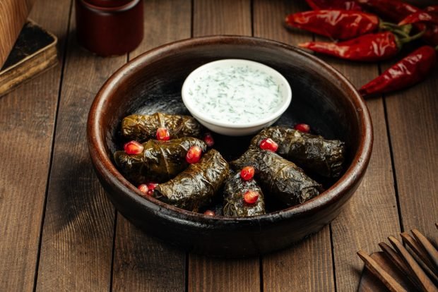 Sauce for dolma made of sour cream with garlic and herbs 