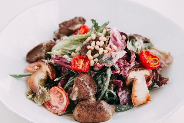 Festive salad with fried mushrooms and herbs