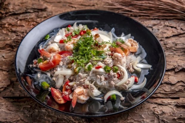 Salad with funchosa, shrimp, minced pork and vegetables