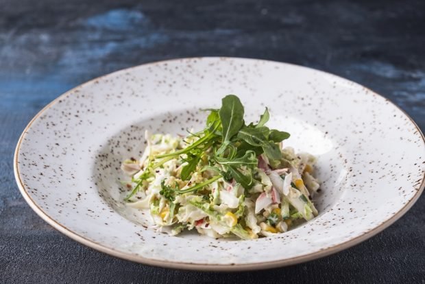 Salad with crab sticks, lettuce and arugula