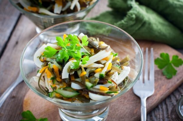 Salad with squid, seaweed, carrots and cucumbers