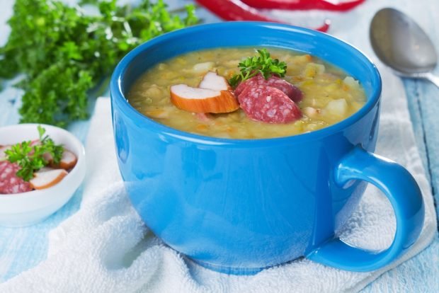 Pea soup with sausage and smoked meats in a slow cooker