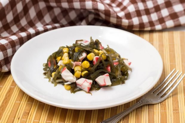 Salad with crab sticks, corn and seaweed 