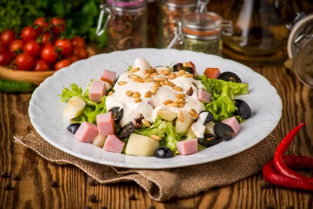 Homemade salad with ham and grapes