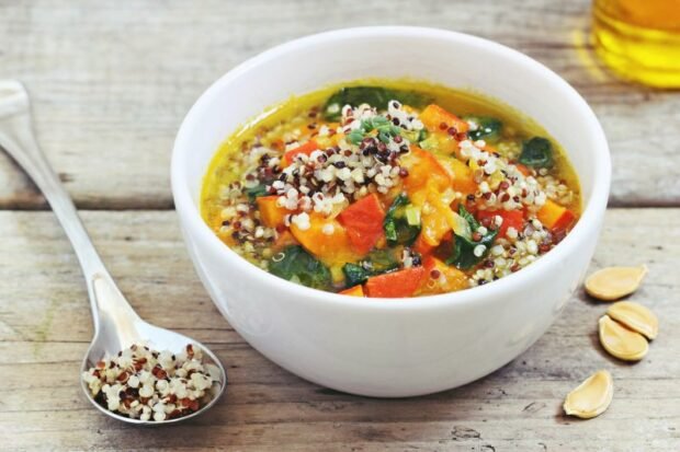 Pumpkin soup with quinoa and spinach