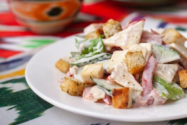 Salad with crab sticks and homemade crackers