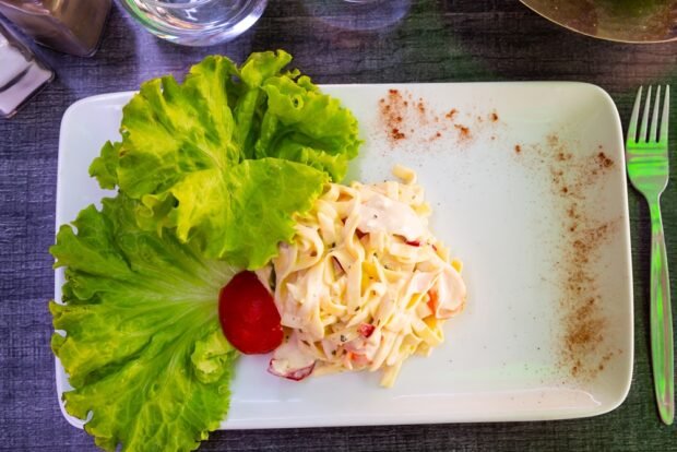 Salad with crab sticks and pasta